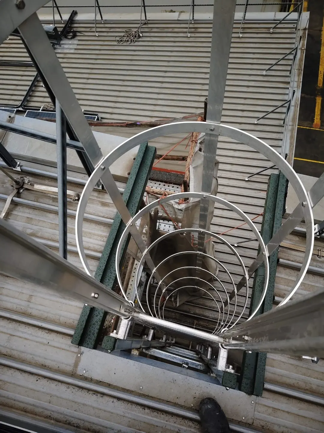 Side view of the ancillary building cat ladder add-on at Buroh Street showing wall-mounting brackets and rung spacing
