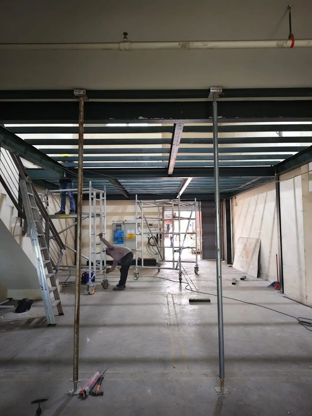 Side context view of the Frontier Industrial Building mezzanine steel frame during construction