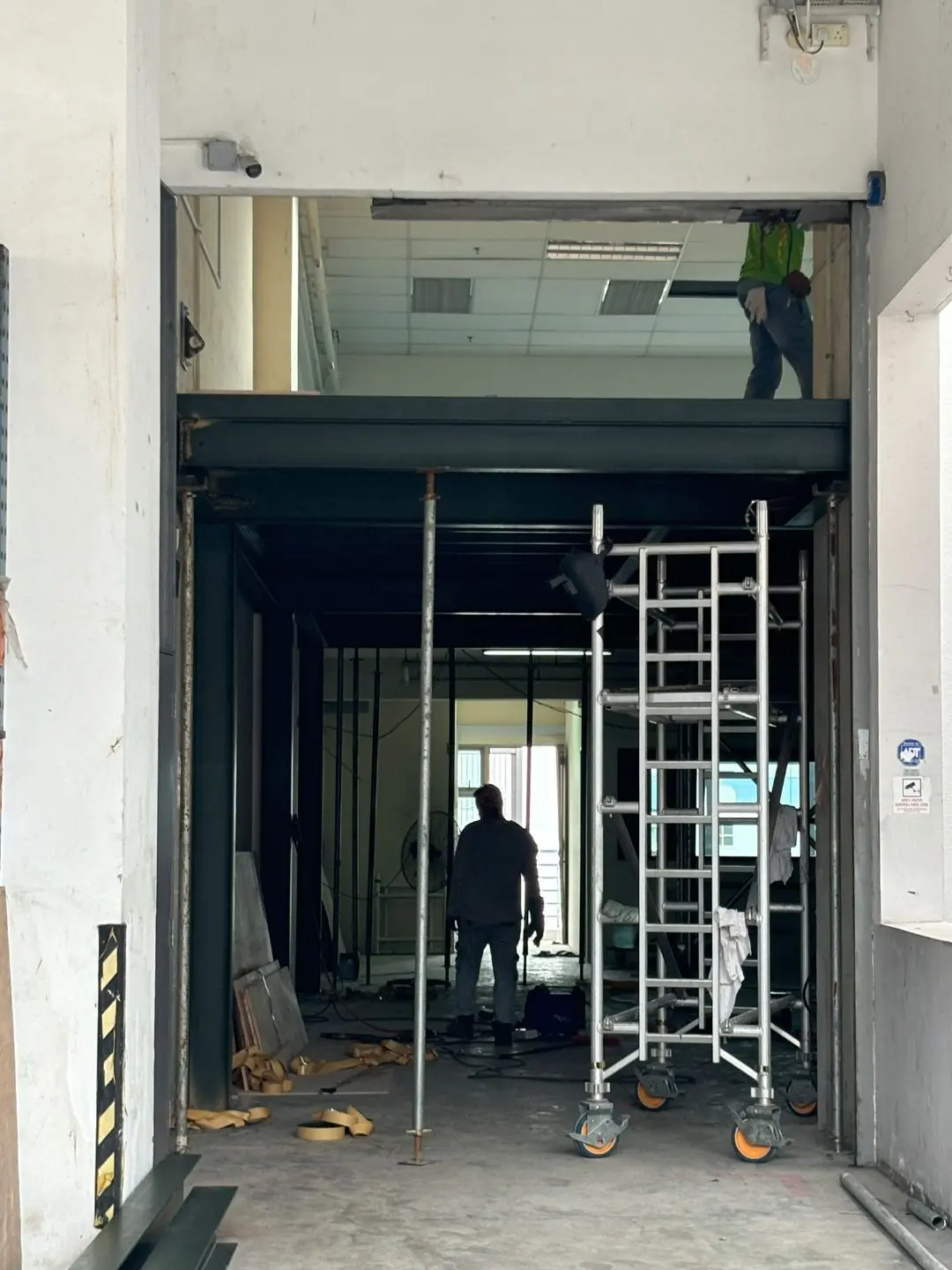 Mezzanine framing extending into the rear bay at Frontier Industrial Building with mobile platform alongside