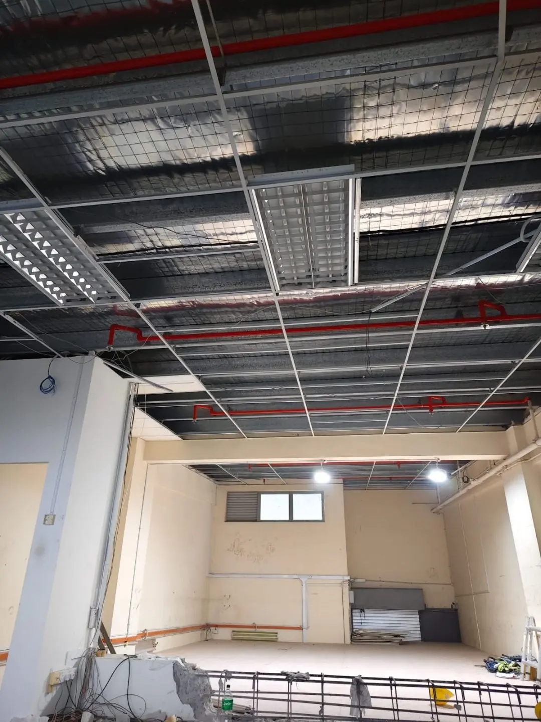 Underside view of the installed mezzanine framing and overhead services at Frontier Industrial Building