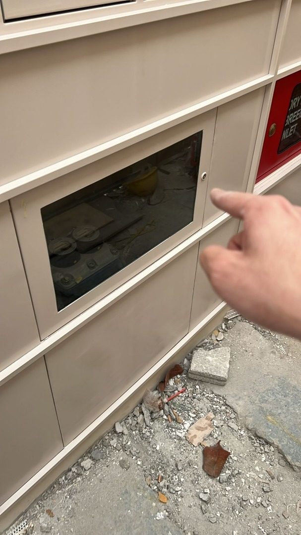 Hand demonstrating a letter slot opening on the Jalan Penhas SS304 mailbox for scale